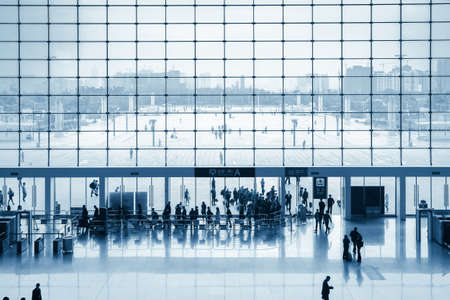 modern railway station entrance with passengers silhouette