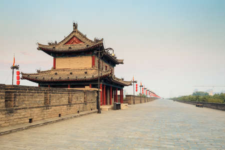 xi'an ancient city wall with tower at dusk , China.の写真素材