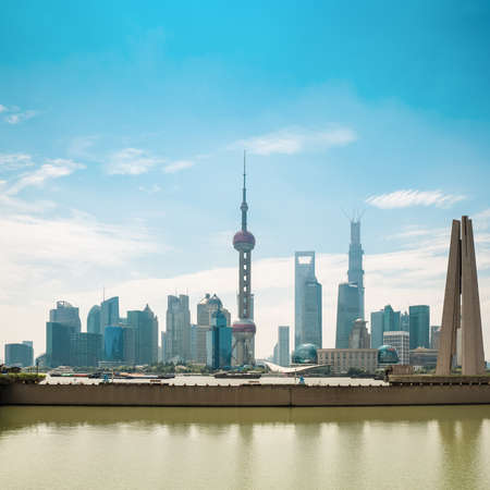 shanghai pudong skyline in daytime with monument and suzhou riverの写真素材