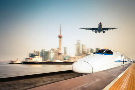 high speed train, airplane and cargo ship with dynamic motion blur background of the shanghai skylineのeditorial素材