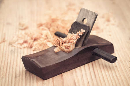 wood planer and shavings closeup on wooden background

の写真素材