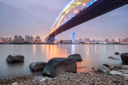 shanghai lupu bridge in nightfall ,it is the world's second longest steel arch bridge.