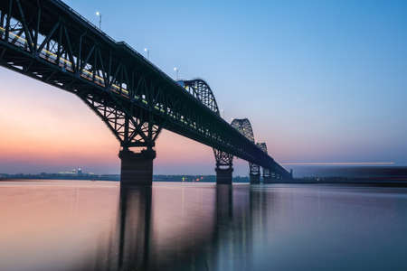 the jiujiang yangtze river bridge in nightfall ,for double railway, highway bridge.
の写真素材