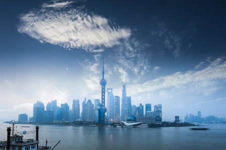 shanghai skyline in dawn against a blue sky