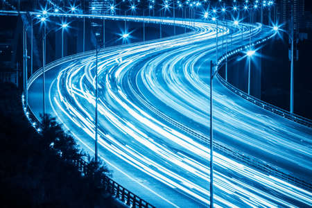 light trails on the xiamen haicang bridge at night , graceful curve shape closeupの写真素材