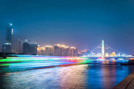 beautiful zhujiang at night  ,light trails of a cruise ship in guangzhouのeditorial素材