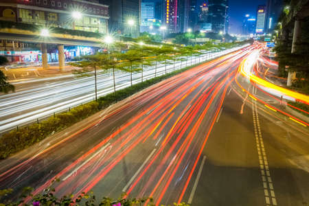 light trails on rush hour traffic at night in guangzhouのeditorial素材