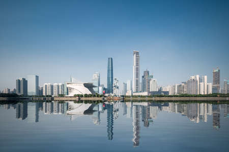 City skyline and reflection in Guangzhou , beautiful pearl river new town at daytime ,Chinaの写真素材