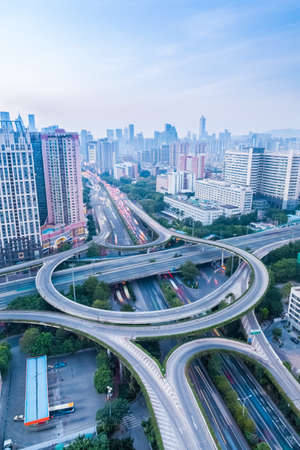 a highway interchange in guangzhou at dusk with vehicles motion blurの写真素材