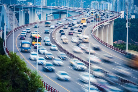curved ramp bridge with busy traffic vehicles motion blurの写真素材