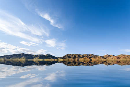 beautiful reflection on the lake against a blue sky in inner mongoliaの写真素材