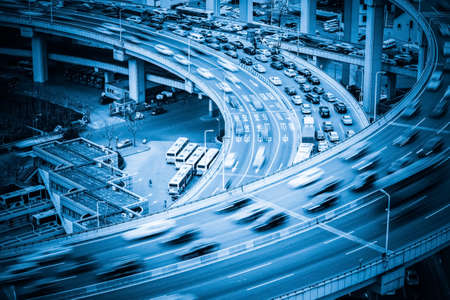 heavy traffic closeup, vehicles motion blur on viaduct with blue tone heavy traffic closeup, vehicles motion blur on viaduct with blue tone