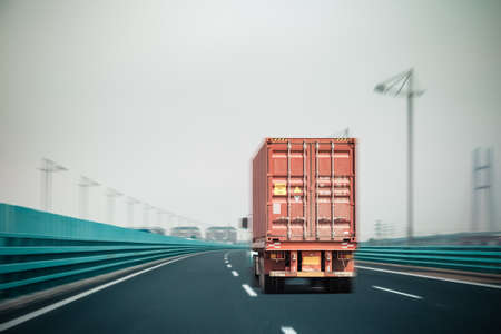container truck on the bridge with motion blur , modern logistics backgroundの写真素材