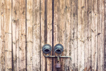 old wooden door and knocker with traditional chinese architectural detailsの写真素材