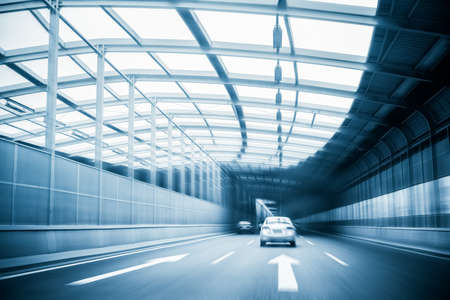 city expressway traffic in a steel structure futuristic constructionの写真素材