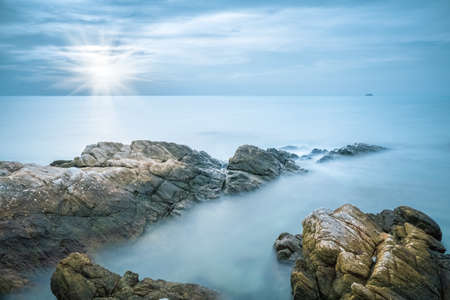 sea and rocks in early morningの写真素材