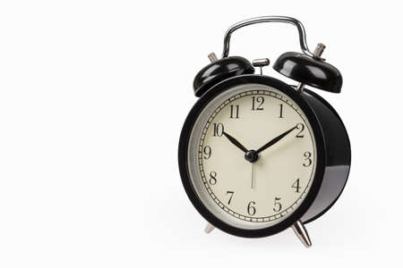 black alarm clock isolated on white backgroundの写真素材