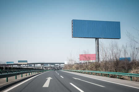highway background and large blank billboardsの写真素材