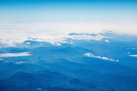 aerial view of the mountains and clouds ,from an airplane