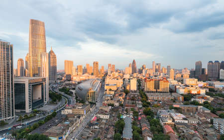 the dusk sunlight shining on the modern buildings , beautiful tianjin, China