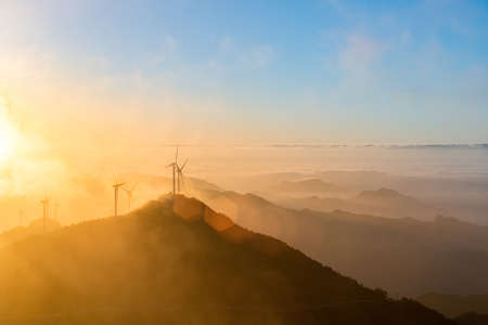 wind turbines at sunrise on the top of jiugong mountain ,hubei province,Chinaの写真素材