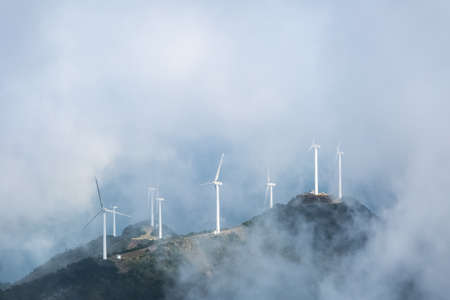 wind farms in the misty clouds on the jiugong mountains ,hubei province,Chinaの写真素材
