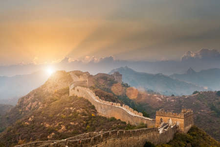 the great wall of china with a beautiful sunsetの写真素材