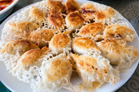 golden fried dumplings, enticing traditional cuisine closeupの写真素材