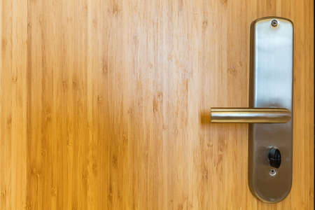 bamboo wood door closeup and door lockの写真素材
