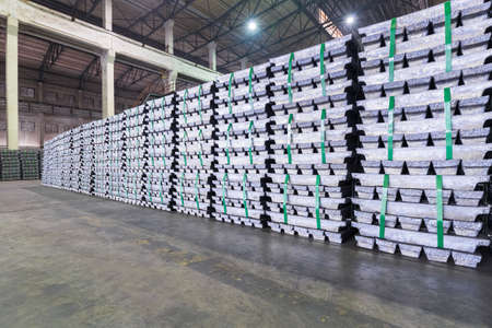 lead ingots in a factory warehouse, industrial manufacturing backgroundの写真素材