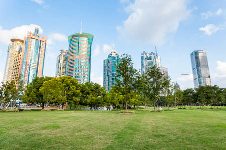 city park and modern financial buildings in shanghaiのeditorial素材