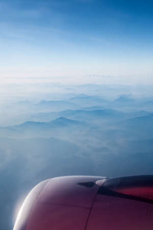 aircraft engine above the blue mountain ranges and sky