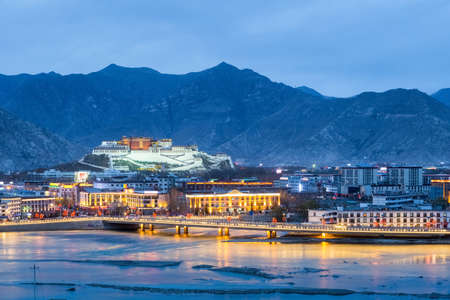 beautiful lhasa in nightfall, aerial view of the potala palace, Chinaのeditorial素材