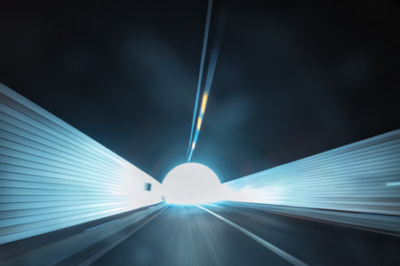 road tunnel exit background to light with speeding car motion blurの写真素材