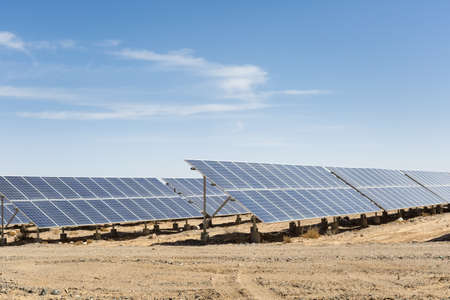 solar panels on the gobi against abundant sunshine sky, clean energy background