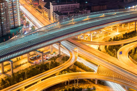 city interchange at night with sound insulation building closeupの写真素材