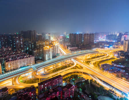 city interchange at night, wuhan cityscape skyline with urban traffic infrastructure background, Chinaの写真素材