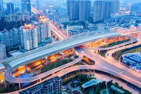 futuristic city interchange closeup in nightfall, wuhan, China