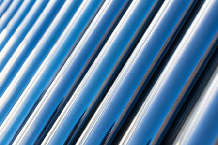 solar water heater closeup , blue vacuum tubes of abstract backgroundの写真素材