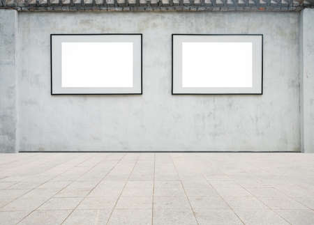 blank frame on the fence wall with granite floorの写真素材