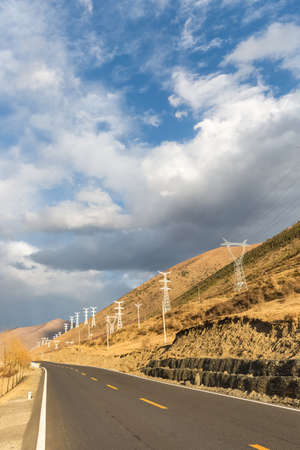 empty asphalt road on the plateau of autumn in tibetan area