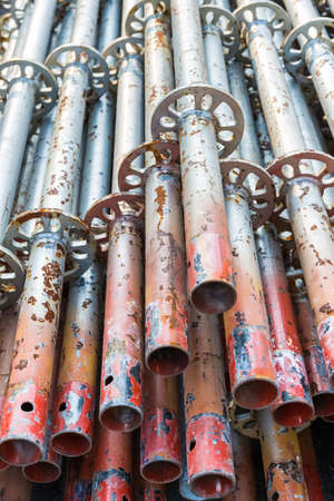 a pile of scaffold pipe, building materials closeup