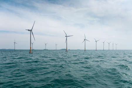 offshore wind farm with beautiful sea water , clean energy backgroundの写真素材