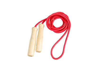 red skipping rope with wooden handles isolated on whiteの写真素材