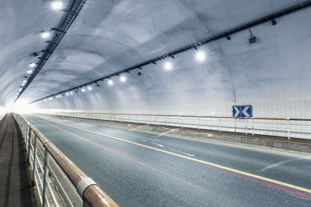 tunnel interior scene with exit, road traffic conceptの写真素材