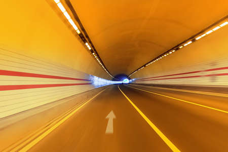 three lane road tunnel background with motion blurの写真素材