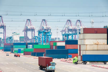 busy container stack yard closeup, modern logistics backgroundの写真素材
