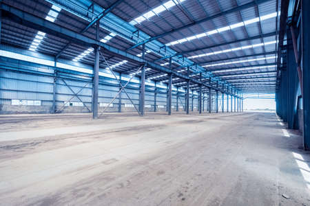 empty steel structure workshop, interior of abandoned factory buildings or warehouse background