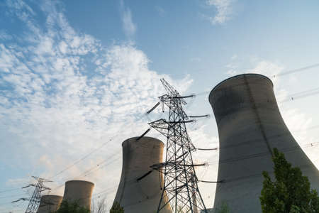 a row of cooling tower at dusk in thermal power plant