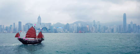 hong kong traditional sailboat, victoria harbor panoramaの写真素材